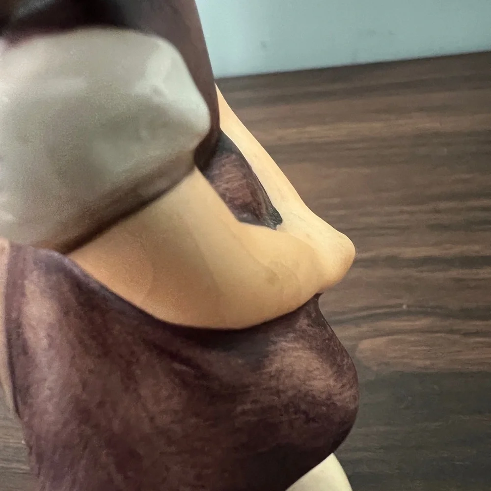 Charming Figurine with Purple and Brown Accents